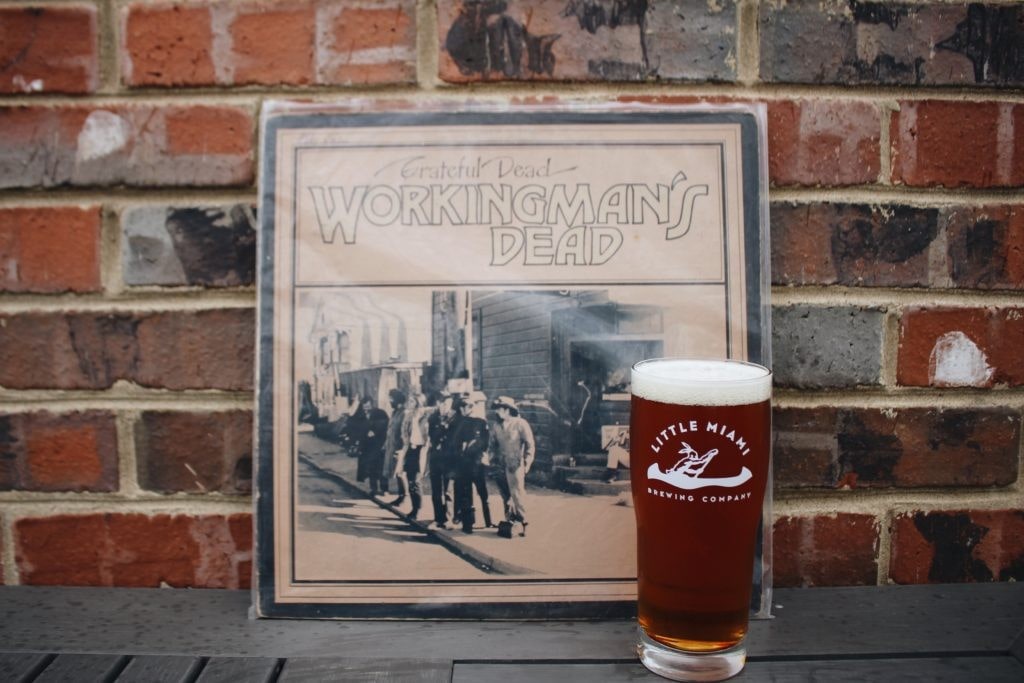 glass of Little Miami Brewing Company's beer, A glass of Little Miami Brewing Company's beer, likely a seasonal or festive flavor, decorated with a holiday rim.